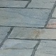 Existing Riven York paving lifted and re-laid, and pointed, with new slabs mixed in to replace cracked/broken slabs.