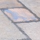Existing Riven York paving lifted and re-laid, and pointed, with new slabs mixed in to replace cracked/broken slabs.