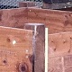 Compost bins constructed with 100mm x 100mm posts, and 22mm x 150mm wide timber gravelboards, with removable fronts for emptying.