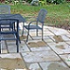 45m² of Holton Limestone natural paving laid around the house, edged with 50mm wide Cotswold chippings.